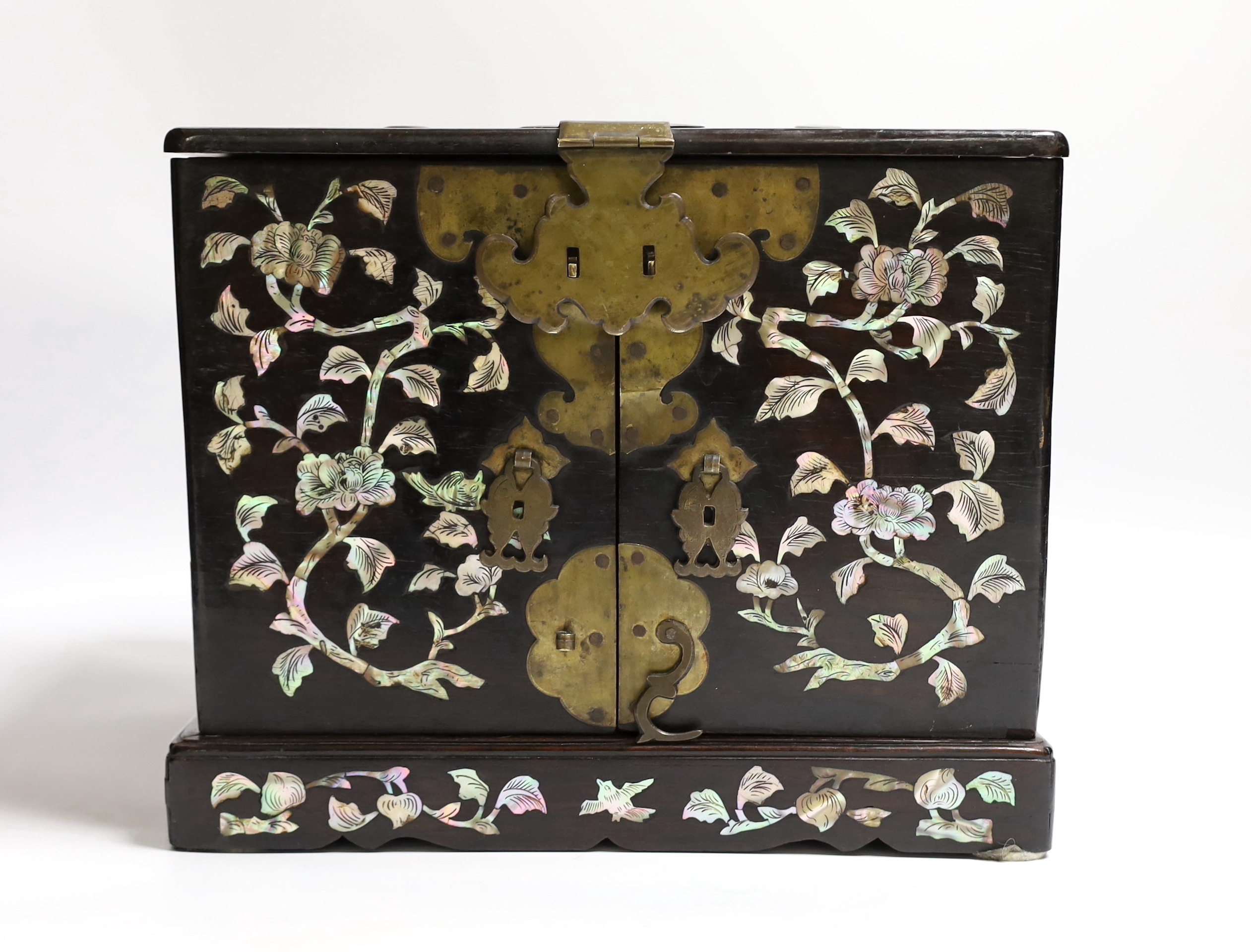 A Chinese mother-of- pearl inlaid hongmu vanity cabinet, late Qing dynasty, with fitted interior comprising a mirror, drawers, etc. 24cm x 31cm x 20cm